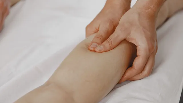 Light, gentle strokes on the leg during manual lymphatic drainage